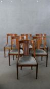 A set of six Biedermeier style fruitwood dining chairs, with a straight splat back over a silver