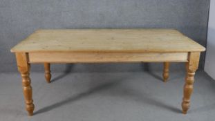 A Victorian pine planked top kitchen table, with an end drawer, on turned legs. H.75 W.186 D.97cm