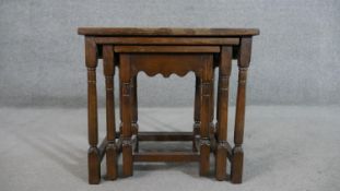 A nest of three 17th century style oak graduating rectangular tables, on turned legs. H. 48 W.52 D.