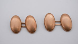 A pair of 9ct rose gold oval cufflinks. Weight 2.68g