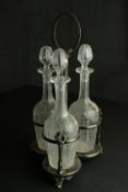 Three Edwardian etched floral and foliate design crystal decanters with stoppers in a repousse