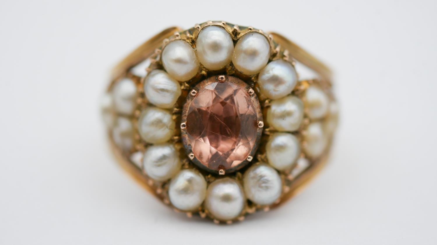 A Georgian pearl and topaz yellow metal cluster ring. Set to centre with an oval foil backed peach - Image 6 of 7