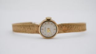 A vintage Swiss Favre-Leuba, ladies 9ct gold cased wristwatch with integral 9ct gold bracelet strap.