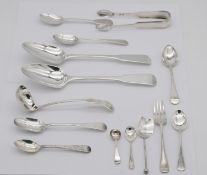 A large collection of fourteen pieces of 19th century silver cutlery, including spoons, a sauce