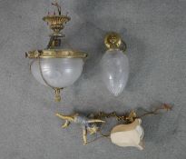 Three early 20th century ceiling lights, including a hanging gilt spelter cherub light with silk