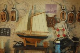 Two late 20th century sailing themed dioramas, one with a model of a pond yacht and one with a