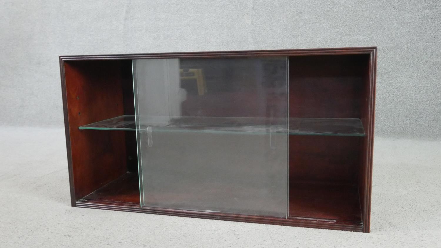 A circa 1970s fruitwood side cabinet, of rectangular form with two glass sliding doors, enclosing an - Image 3 of 5