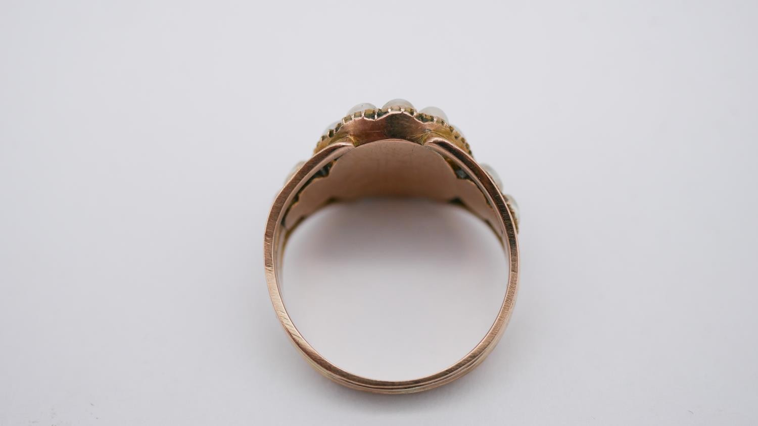 A Georgian pearl and topaz yellow metal cluster ring. Set to centre with an oval foil backed peach - Image 4 of 7