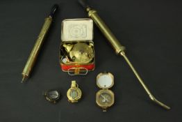 A collection of brass instruments. Including a Stanley London brass nautical compass with Natural