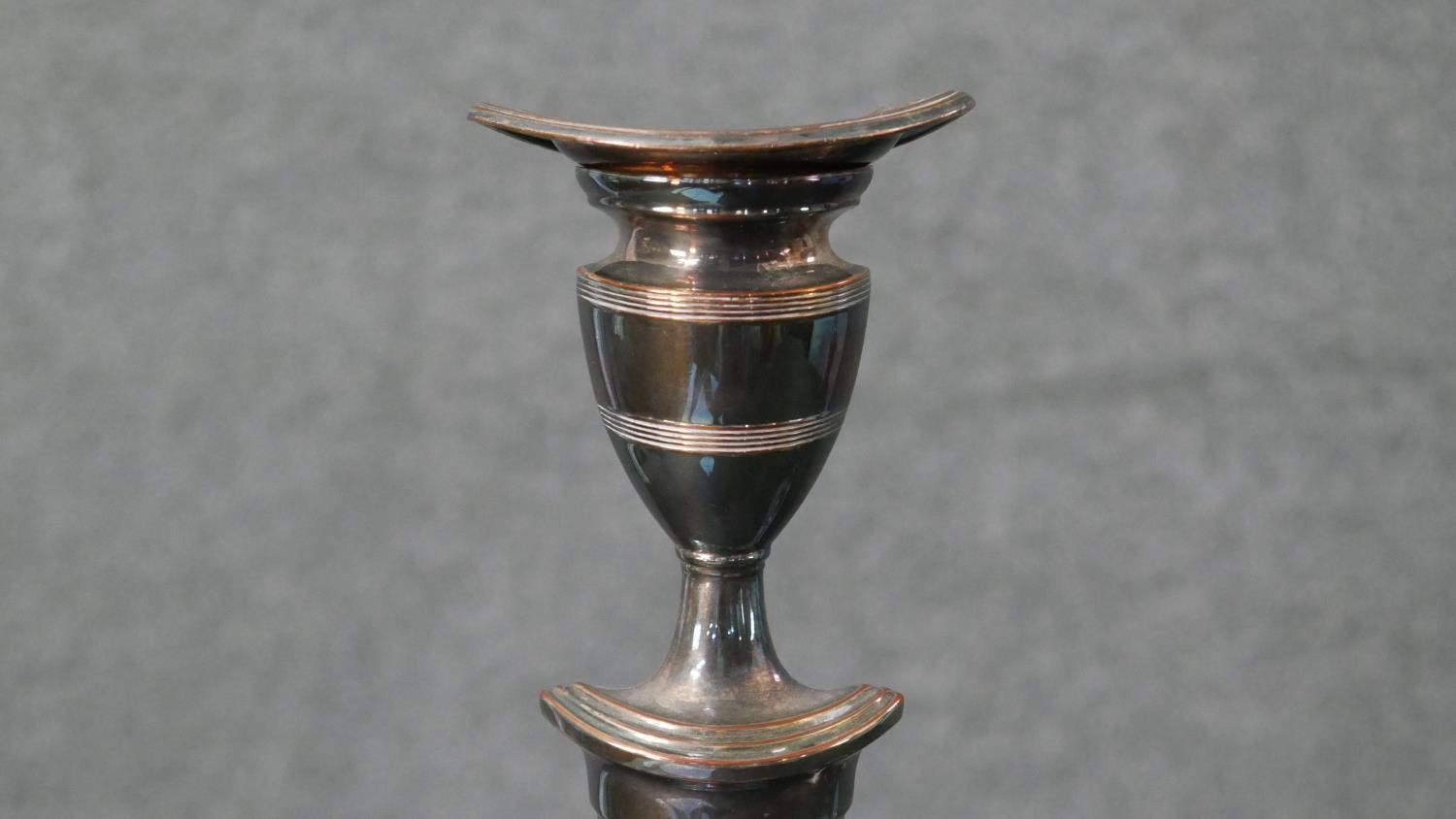 A pair of early 20th century silver plated candlesticks with weighted bottoms. H.29 W.17cm - Image 3 of 5