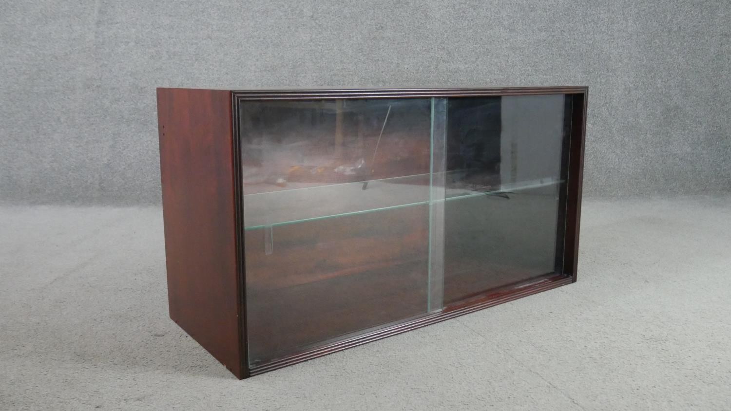 A circa 1970s fruitwood side cabinet, of rectangular form with two glass sliding doors, enclosing an - Image 5 of 5