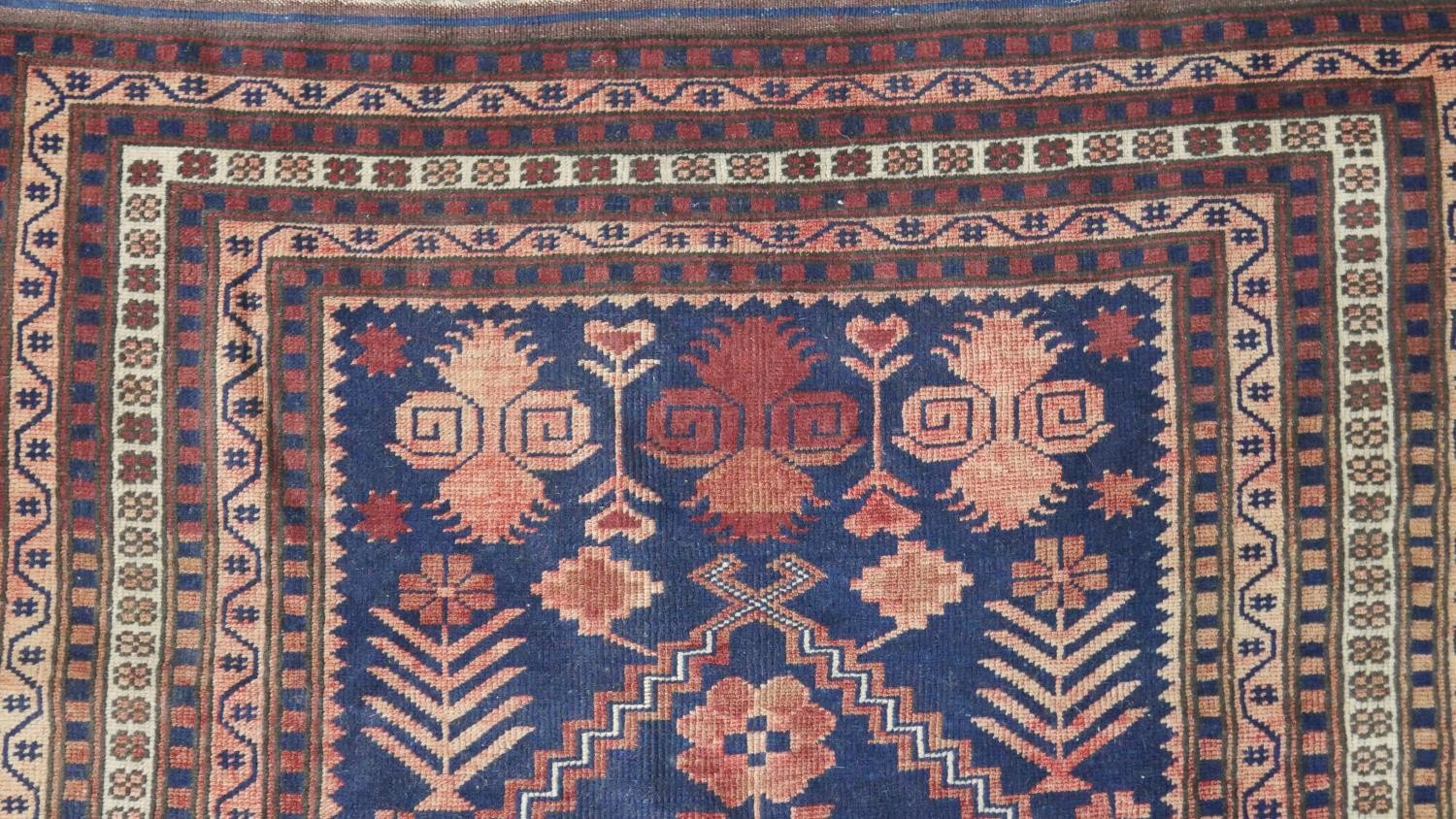 A handmade Turkish Yagcibedir rug, on a blue ground. L.108 W.118cm. - Image 5 of 7