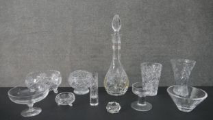A large collection of crystal, including a decanter with stopper, various designs of vases and other
