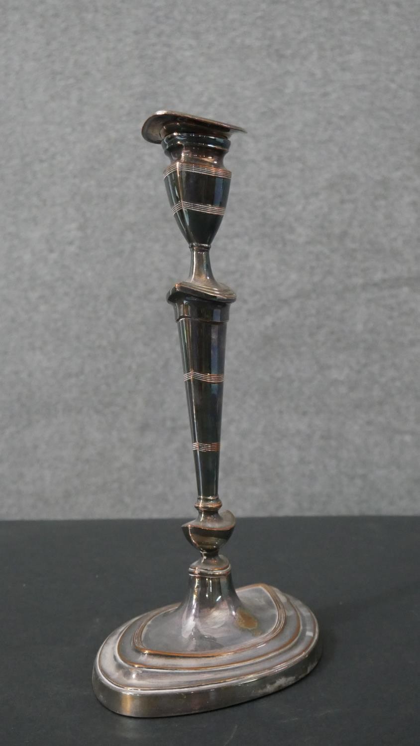 A pair of early 20th century silver plated candlesticks with weighted bottoms. H.29 W.17cm - Image 4 of 5