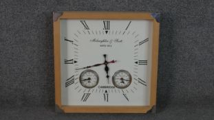 A reproduction square McLaughlin & Scott wall clock with pine frame. H.40 W.40cm