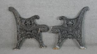 Two Victorian style painted cast iron bench ends. H.78 W.71cm