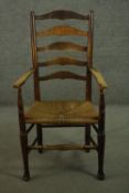 A 19th century ash ladder back open armchair, with a woven seat, on turned legs, joined by