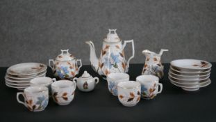An early 20th century hand painted floral design porcelain six person dolls tea set.