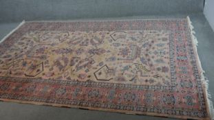 A handmade Indian part-silk Agra carpet, on a beige ground. L.290 W.188cm.