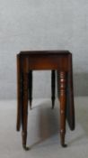 A 19th century mahogany drop leaf dining table, on ring turned gate legs. H.74 W.149 D.107cm