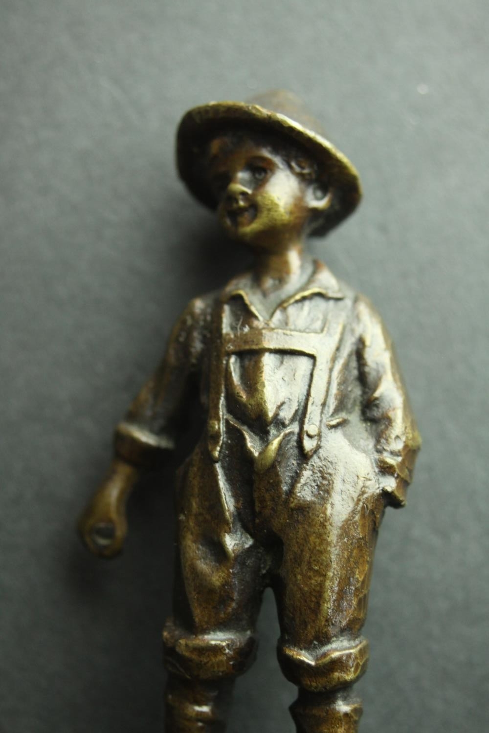 A bronze figure of an Austrian boy mounted on a serpentine marble base. H.13cm. - Image 4 of 5