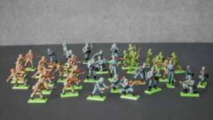A collection of hand painted and plastic Britain's Deetail WWII military figures, British, German