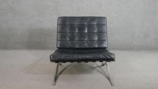 After Ludwig Mies van der Rohe, a Barcelona chair, with a chromed steel frame, black buttoned