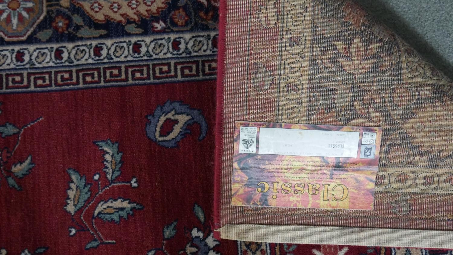 A woollen Keshan motif carpet, on a red ground. L.290 W.200cm. - Image 2 of 7