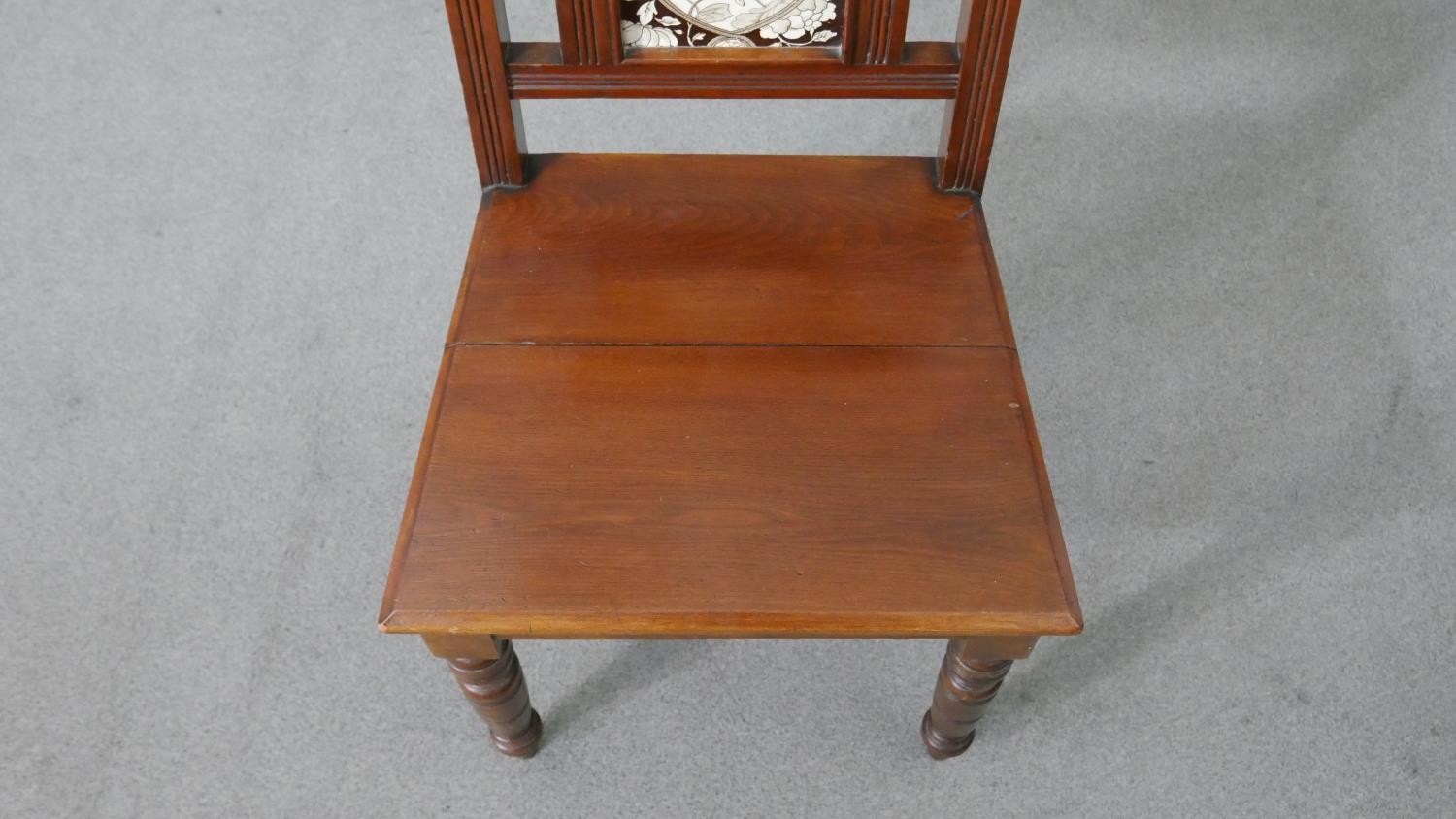 A pair of Victorian walnut Aesthetic movement hall chairs, the back set with a single tile, possibly - Image 7 of 8