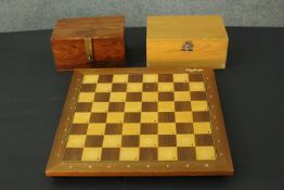 A 1980's Mephisto Exclusive hardwood modular electronic chess board along with two boxed chess sets.