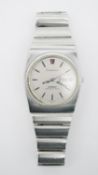 A boxed Omega Constellation Mega Quartz 32 KHZ steel wrist watch with date-day display. Signed