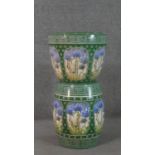 A Minton Secessionist jardiniere and stand, relief moulded with green and blue stylised flowers, one