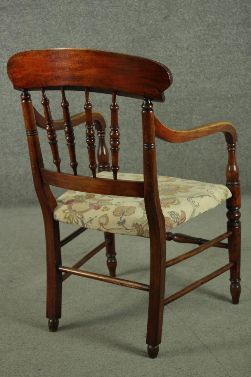 A rustic stained beech bar back open armchair, with turned spindles over a tapestry style seat, on - Image 4 of 7