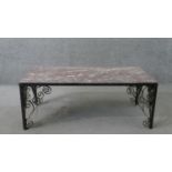 A vintage rectangular rouge marble topped coffee table, on an iron frame with scrolling wrought iron