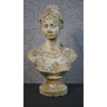 A composite bust of a young female with her hair up on a pedestal base. (head repaired) H.35 W.20cm