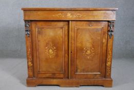 A 19th century marquetry inlaid satin walnut side cabinet, inlaid with a figure on horseback, the