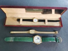 Three watches, including a boxed Raymond Weil ladies watch with leather strap and papers, a