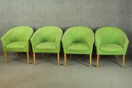 A set of four late 20th century tub chairs, upholstered in green fabric, on square section