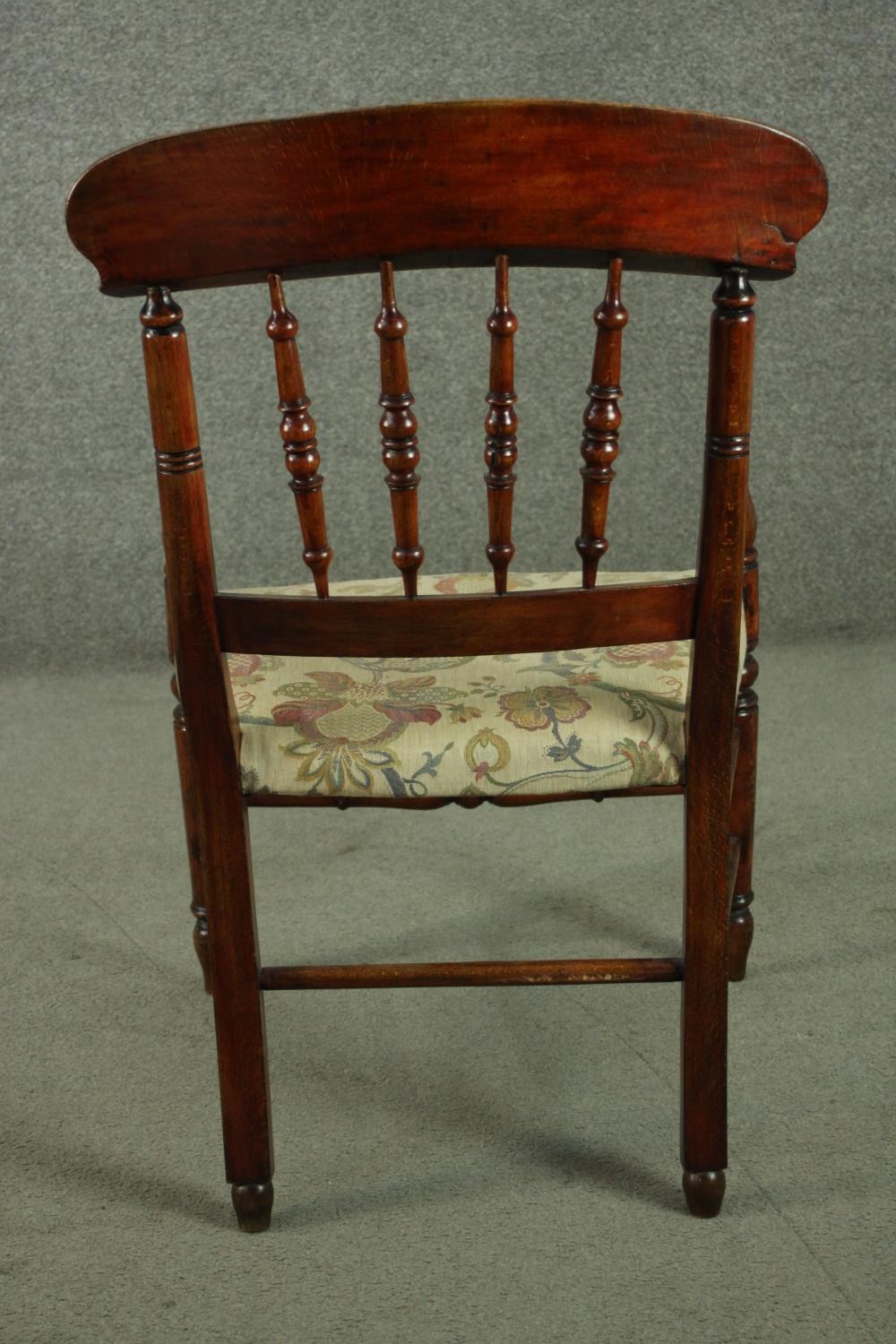 A rustic stained beech bar back open armchair, with turned spindles over a tapestry style seat, on - Image 5 of 7