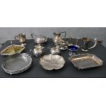 A large collection of silver plate, including a pair of candlesticks, a four piece tea set with