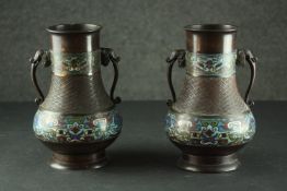 A pair of 19th century Japanese cloisonné enamel bronze vases with elephant form handles and