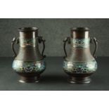 A pair of 19th century Japanese cloisonné enamel bronze vases with elephant form handles and