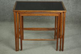 Grete Jalk for Poul Jeppesen, a Danish 1950s teak nest of three tables, with black inlay tops, on