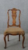 An 18th century Dutch marquetry inlaid tulipwood side chair, with a vase splat back, over a brown