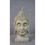 A 20th century concrete Buddha head. H.50 W.25 D.25cm