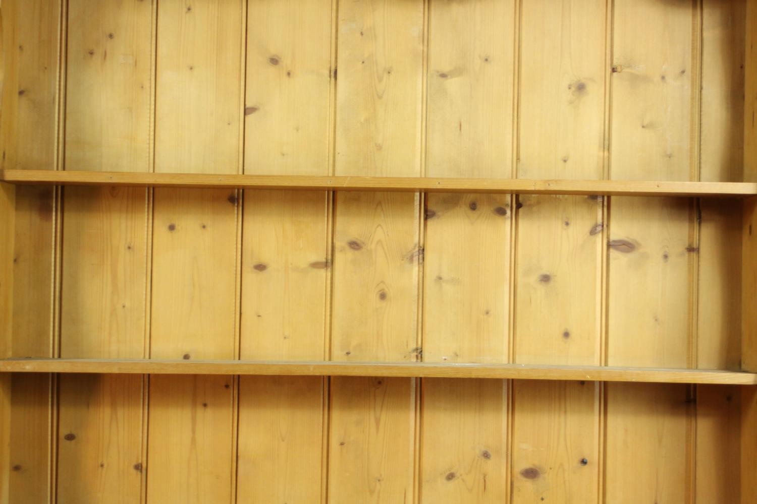 A Victorian style pine kneehole dresser with open plate rack above three short drawers over three - Image 4 of 8