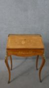 A late 19th century French kingwood bureau de dame, with a pierced brass three quarter gallery,