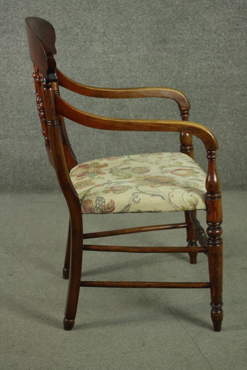 A rustic stained beech bar back open armchair, with turned spindles over a tapestry style seat, on - Image 3 of 7