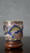 A Chinese Plique a Jour enamel cup decorated with dragons and flaming pearl. H.8 Diam.7.5cm