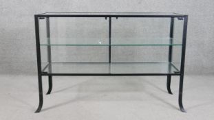 A contemporary glass counter display cabinet, of rectangular form with two glass doors and a glass